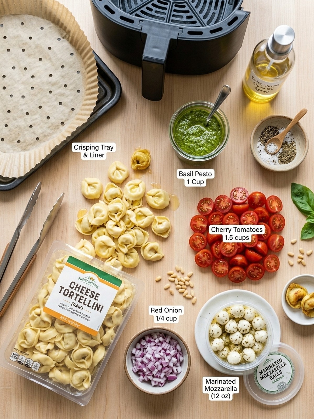Pesto Tortellini Pasta Salad ingredients with cheese tortellini pesto tomatoes mozzarella and red onion